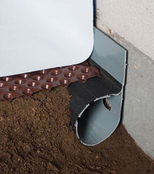 Closeup of a crawl space drainage system installed in Paradise Valley