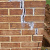 Tuckpointing that cracked due to foundation settlement of a Tucson home