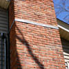 A tilting chimney on a Winslow home with a leaning, tilting chimney that was temporarily repaired.