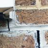Failed crack repair showing old tuckpointing that cracked on a Glendale home.