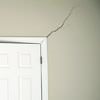 A long drywall crack beginning at the corner of a doorway in a Bullhead City home.