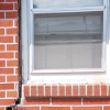 A gap in a window along the outer wall due to foundation settlement of a Kingman home.