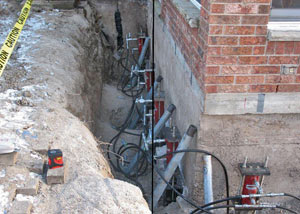 Foundation push piers installed around a house with a foundation settlement issues in Paradise Valley