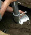 Scottsdale helical pier installation nearing completion, with the blade being advanced into the foundation soils.